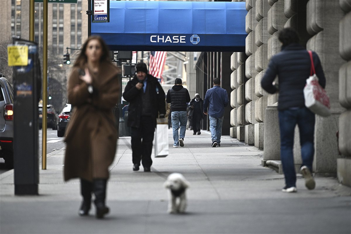 <i>Anthony Behar/Sipa USA/AP</i><br/>People walk along Park Avenue near a JPMorgan Chase bank branch in New York