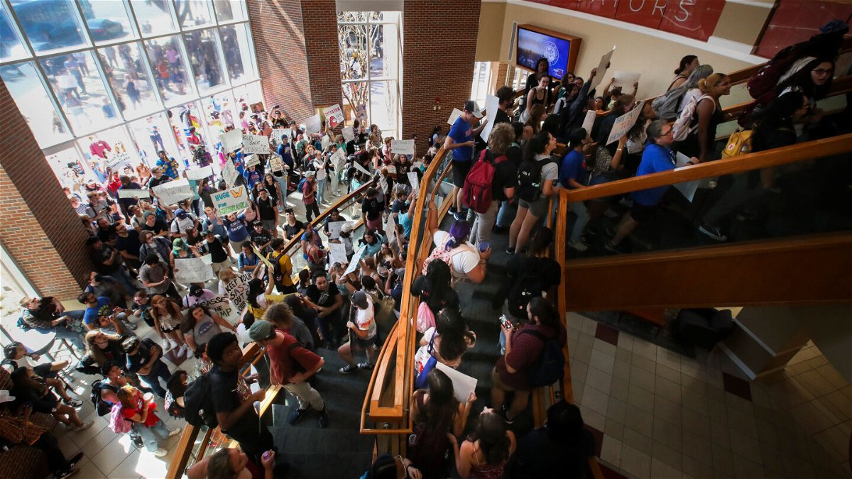 <i>Dirk Shadd/Tampa Bay Times via ZUMA Press Wire</i><br/>Students protest at the University of Florida as Republican Sen. Ben Sasse of Nebraska talks during a UF Students Open Forum on October 10
