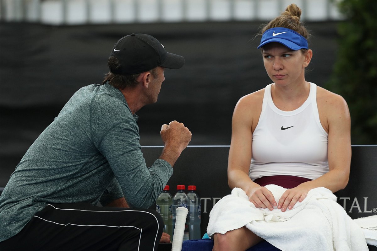 <i>Paul Kane/Getty Images</i><br/>Simona Halep talks with her former coach Darren Cahill during a match in 2020.