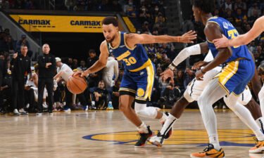 Steph Curry dribbles the ball against the Denver Nuggets at Chase Center in San Francisco