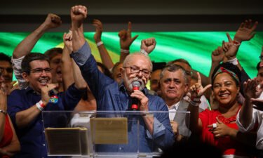 Luiz Inacio Lula da Silva (center) speaks after the announcement that he had won the election on October 31.