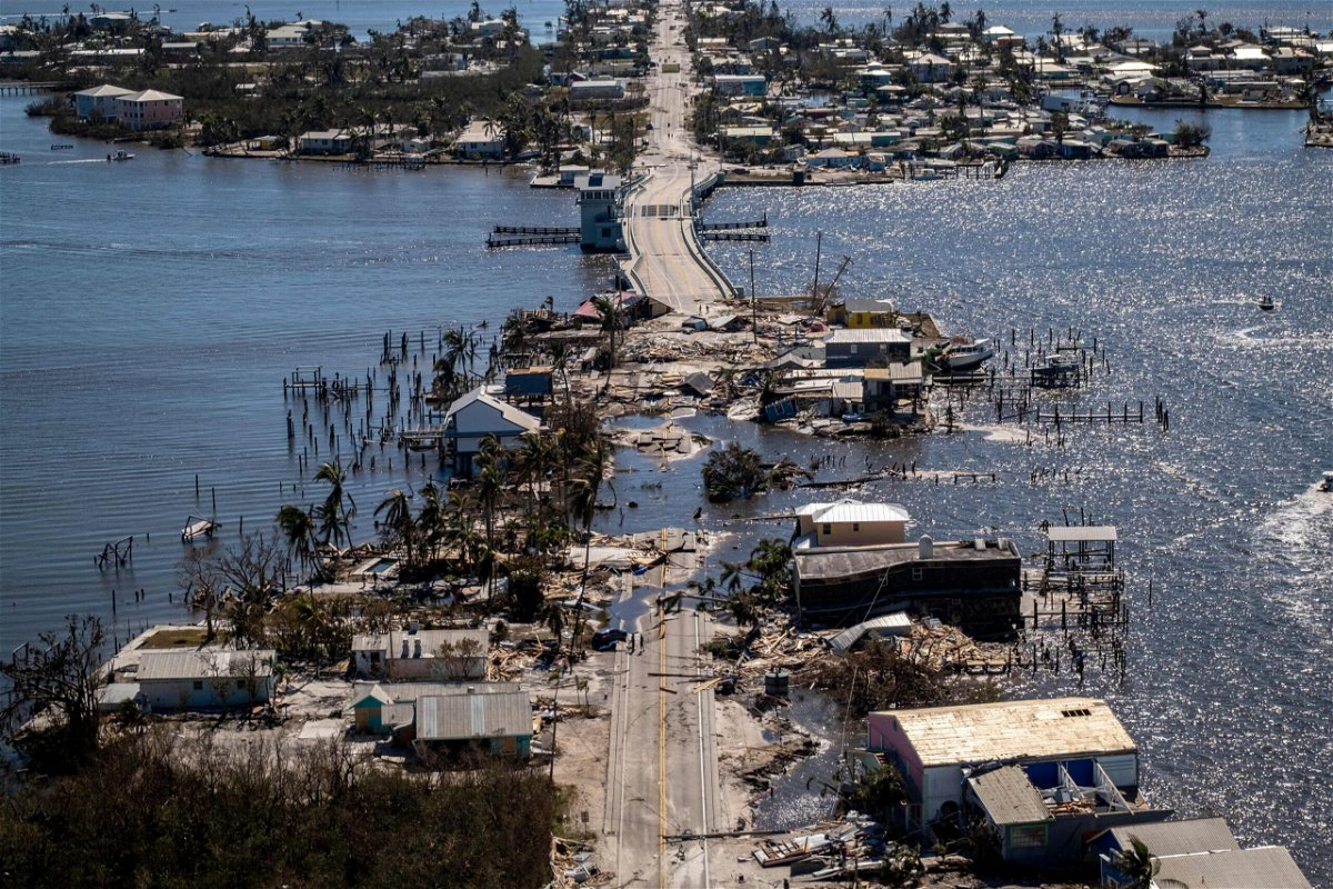 <i>Ricardo Arduengo/AFP/Getty Images</i><br/>An aerial picture taken on Friday shows the only access to the Matlacha neighborhood destroyed in the aftermath of Hurricane Ian in Fort Myers