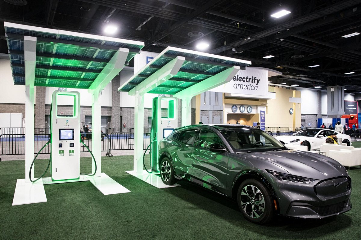 <i>Al Drago/Bloomberg/Getty Images</i><br/>A Ford Motor Co. Mustang next to an Electrify America electric vehicle (EV) charging station during the Washington Auto Show in Washington