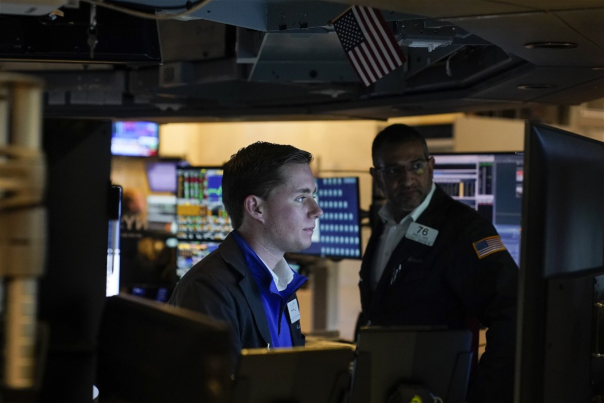 <i>Seth Wenig/AP</i><br/>Stocks are up modestly so far on Tuesday. Traders work on the floor at the New York Stock Exchange