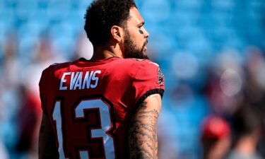 The NFL says the two game officials seen in a video interacting with Tampa Bay Buccaneers' Mike Evans were not asking for the wide receiver's autograph.
