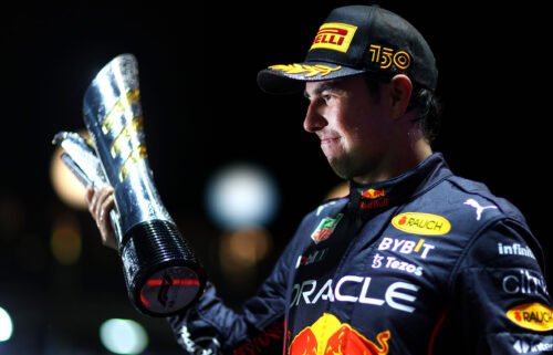 Race winner Sergio Perez of Mexico and Oracle Red Bull Racing celebrates on the podium during the F1 Grand Prix of Singapore at Marina Bay Street Circuit on October 2 in Singapore