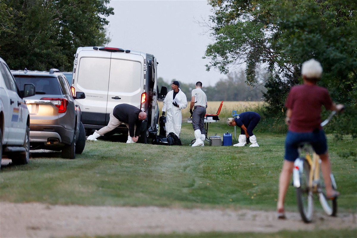 <i>David Stobbe/Reuters</i><br/>A police forensics team investigates a crime scene after multiple people were killed last month in Saskatchewan