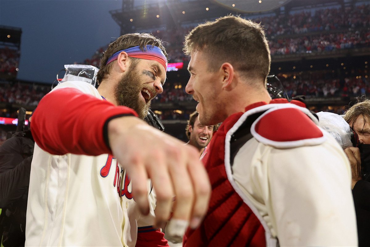 <i>Tim Nwachukwu/Getty Images</i><br/>Bryce Harper of the Philadelphia Phillies celebrates with J.T. Realmuto after defeating the San Diego Padres in Game 5 to win the National League Championship Series on October 23