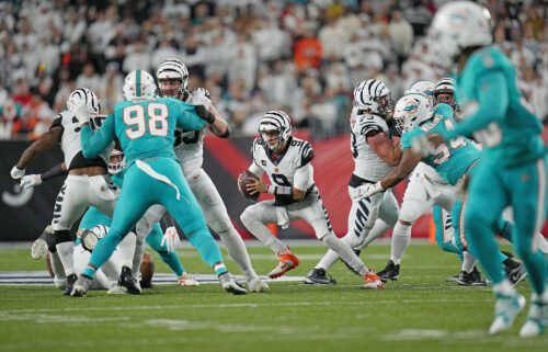 Joe Burrow runs with the ball in the second quarter against the Miami Dolphins.