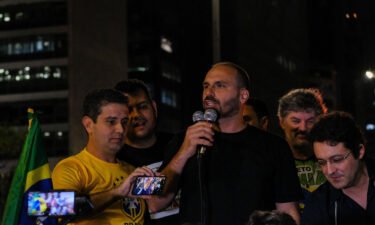 Lawmaker Eduardo Bolsonaro addresses a 'free speech rally' in São Paulo.