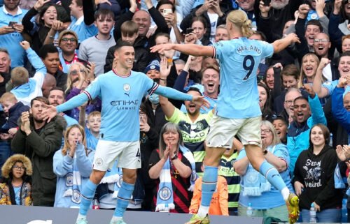 Phil Foden of Manchester City celebrates scoring their sixth goal and also his hat trick with fellow hat trick scorer Erling Haaland of Manchester Cityduring the Premier League match at the Etihad Stadium