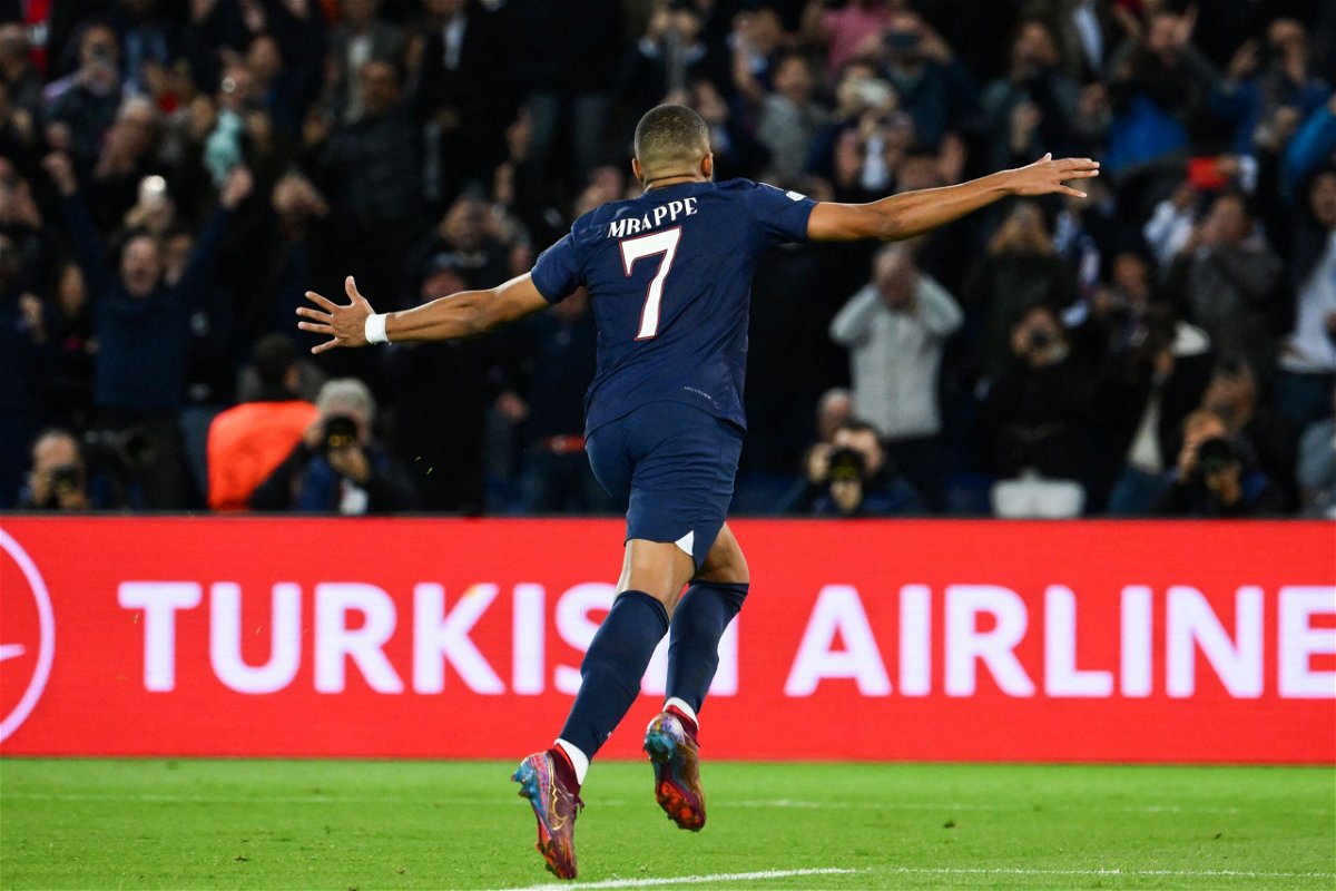 <i>Anne-Christine Poujoulat/AFP/AFP via Getty Images</i><br/>Mbappe celebrates scoring his penalty against Benfica on Tuesday.