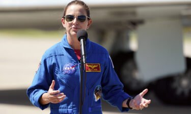 NASA astronaut Nicole A. Mann speaks during a news conference at the Kennedy Space Center in Florida on October 1.  Mann will be the first Native American woman ever to travel to Earth's orbit.