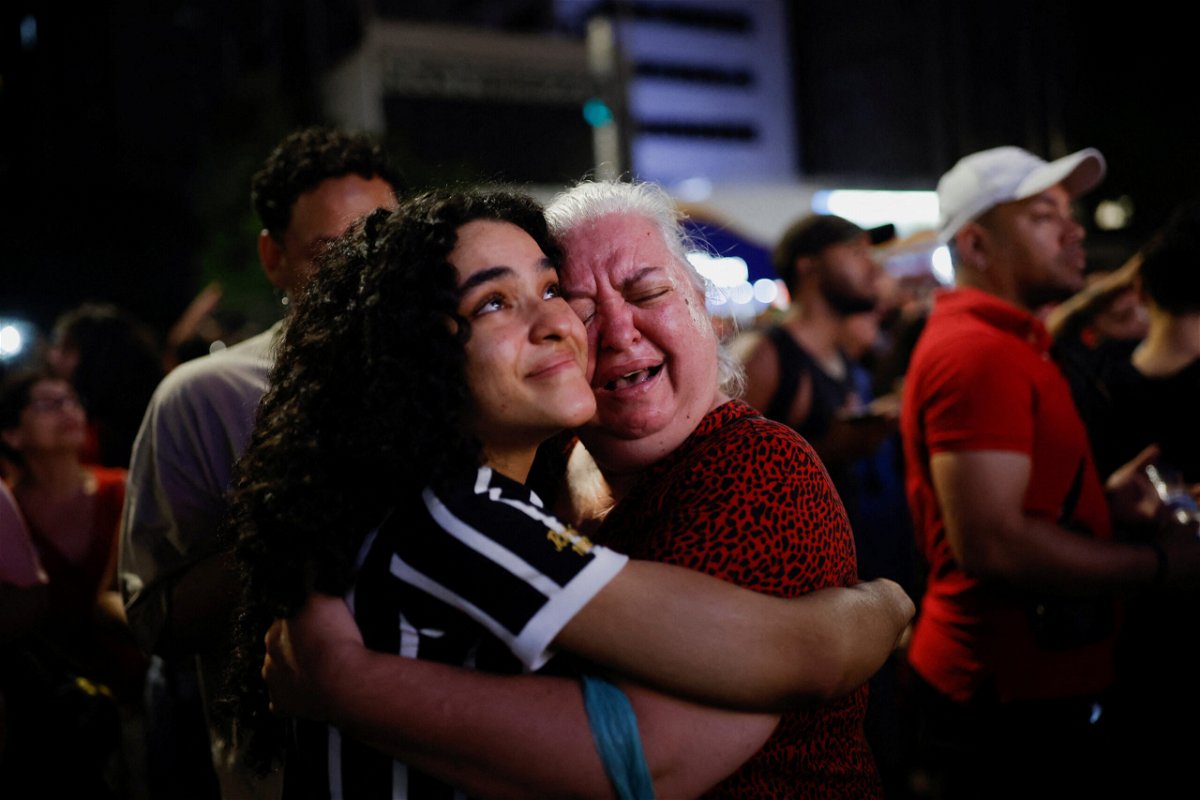 <i>Amanda Perobelli/Reuters</i><br/>Supporters of Lula da Silva react as they wait for results in Sao Paulo