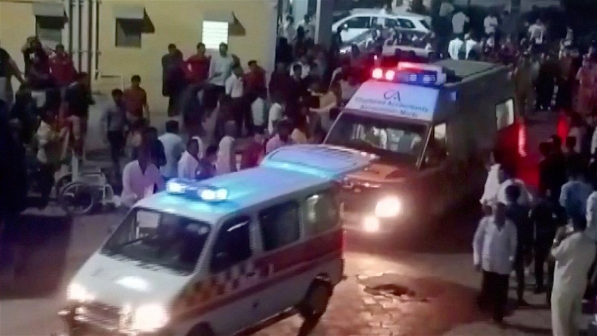 Ambulances arrive at a hospital following the collapse of the suspension bridge in Morbi. At least 60 people were killed in India on October 30 when a bridge collapsed in the western state of Gujarat.