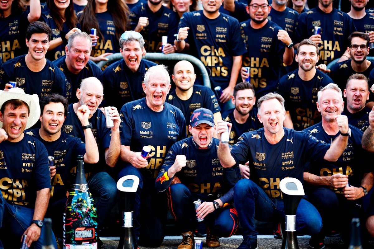 <i>Chris Graythen/Getty Images</i><br/>Verstappen poses with the Red Bull team to celebrate winning the constructors' championship.