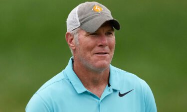 Former NFL player Brett Favre walks up the 14th fairway during the Celebrity Foursome at the second round of the American Family Insurance Championship at University Ridge Golf Club on June 11