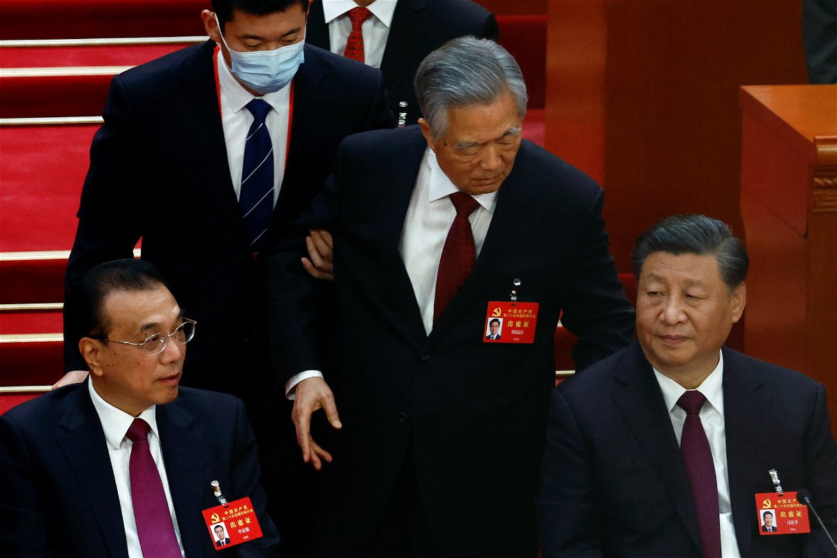<i>Tingshu Wang/Reuters</i><br/>Former Chinese leader Hu Jintao leaves his seat next to leader Xi Jinping and Premier Li Keqiang