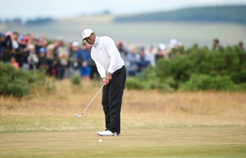 Woods plays a shot at the Open Championship in St. Andrews