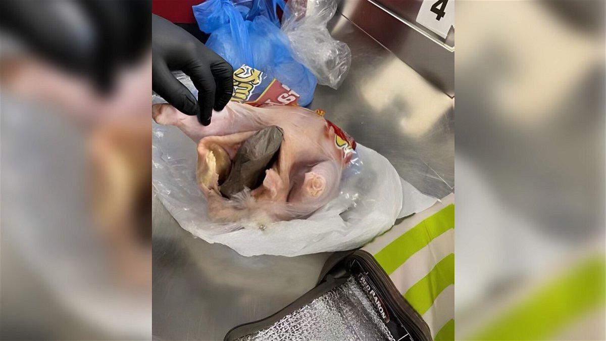 A gun was found inside a raw chicken at an airport security checkpoint.