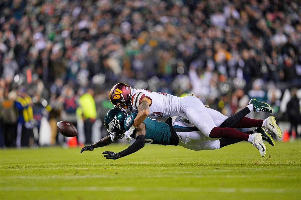 <i>Andy Lewis/Icon Sportswire/Getty Images</i><br/>Commanders cornerback Benjamin St-Juste knocks the ball from Eagles wide receiver Quez Watkins.