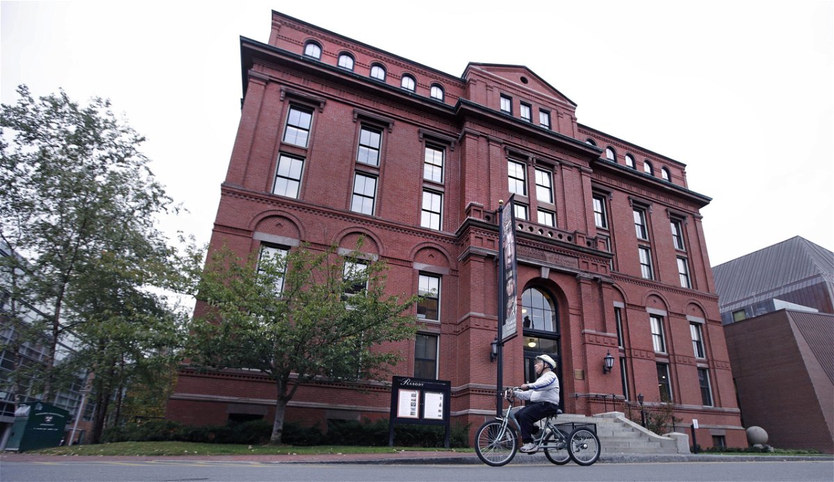 <i>Charles Krupa/AP</i><br/>A cyclist rolls past the Peabody Museum of Archaeology & Ethnology at Harvard University in Cambridge