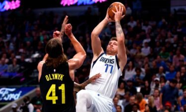 Doncic shoots over Kelly Olynyk of the Utah Jazz in the first half at American Airlines Center on November 2.