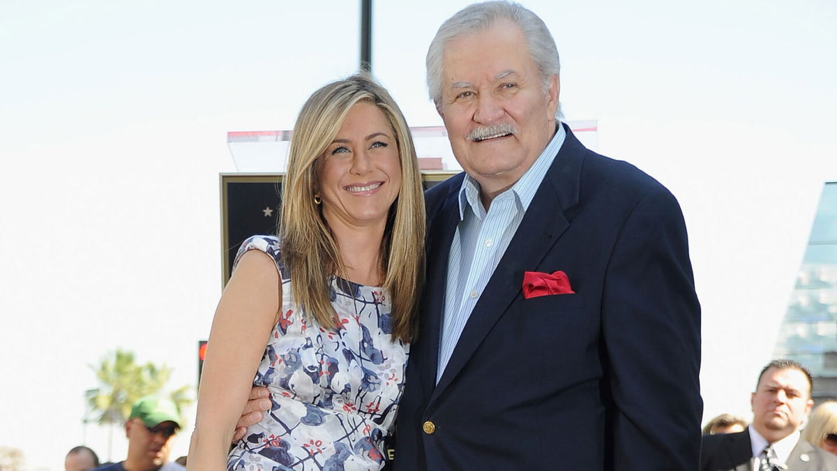 HOLLYWOOD, CA - FEBRUARY 22:  Actress Jennifer Aniston poses who was honored with a star the the Hollywood Walk Of Fame poses with her father John Aniston on February 22, 2012 in Hollywood, California.  (Photo by Frazer Harrison/Getty Images)