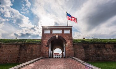 Historic American flying over the entrance to Fort McHenry National Monument