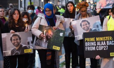 Alaa Abd El-Fattah's supporters take part in a candlelight vigil outside London's Downing Street on November 6.