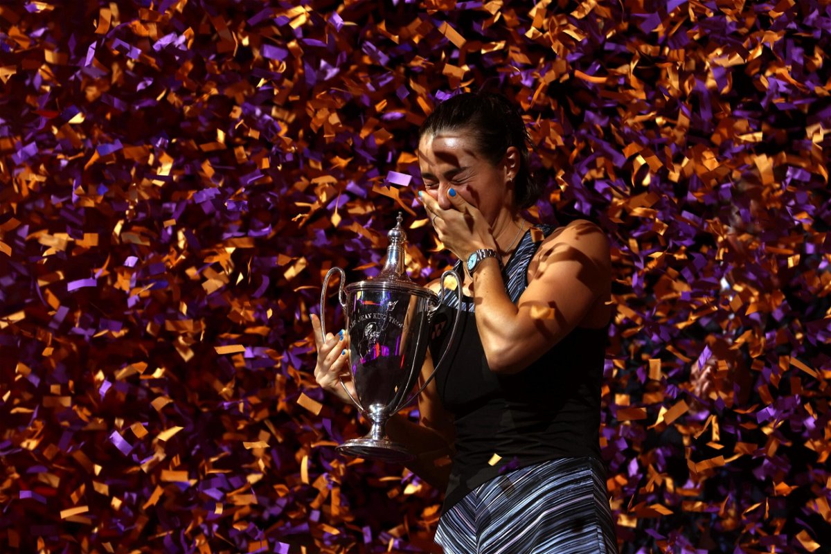 <i>Katelyn Mulcahy/Getty Images North America/Getty Images</i><br/>Caroline Garcia celebrates with the WTA Finals trophy after beating Aryna Sabalenka on November 7 in Fort Worth