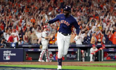 Yordan Alvarez #44 of the Houston Astros hits a three-run home run against the Philadelphia Phillies during the sixth inning in Game Six of the 2022 World Series.