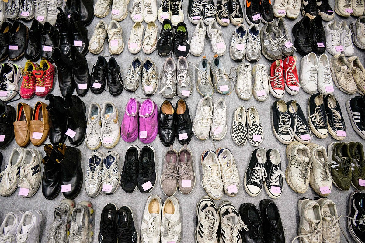 A total of 256 pairs of shoes were lined up at the gymnasium -- 66 did not have a pair.