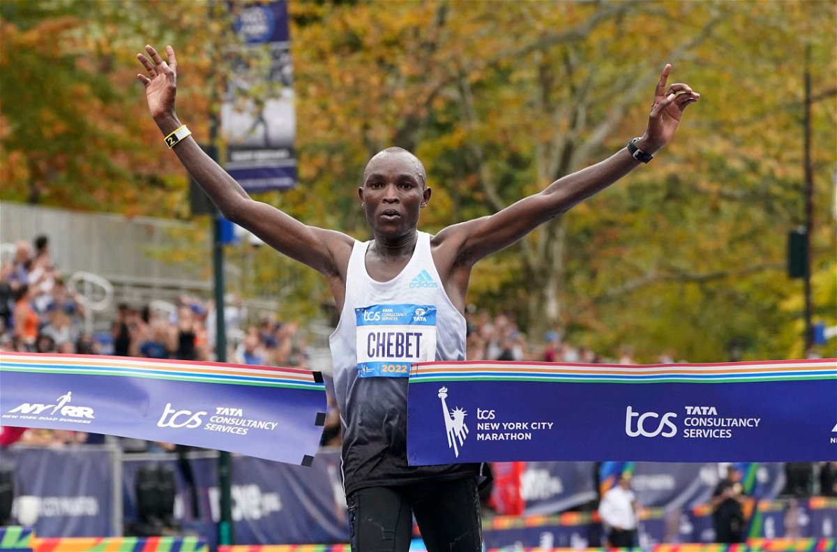 <i>TIMOTHY A. CLARY/AFP/AFP via Getty Images</i><br/>Chebet crosses the finish line of the NYC Marathon.