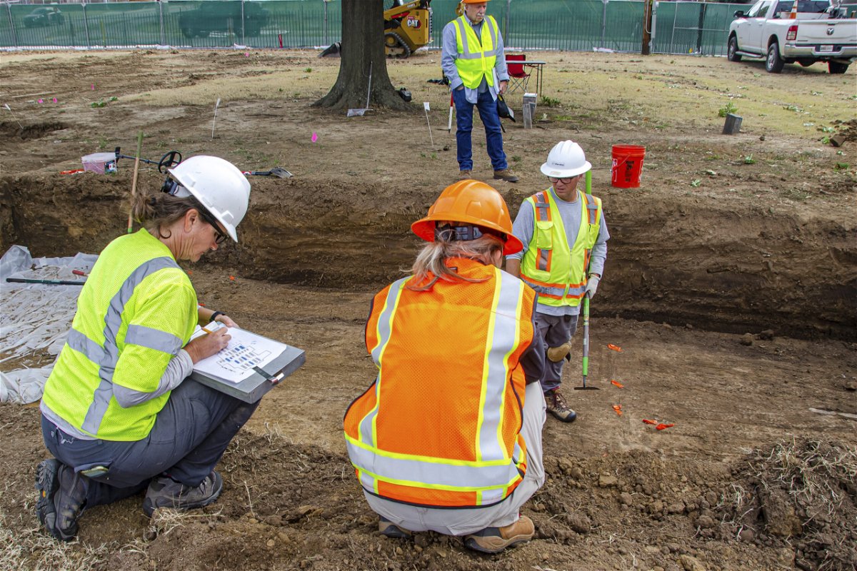 <i>AP</i><br/>State archaeologist Kary Stackelbeck makes notes at an excavation site at Oaklawn Cemetery while searching for victims of the 1921 Tulsa Race Massacre