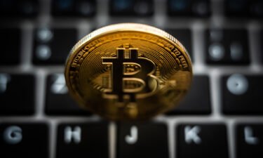 Crypto is in crisis. It's not just because of FTX. A symbolic "Bitcoin coin" is seen here on a computer keyboard.