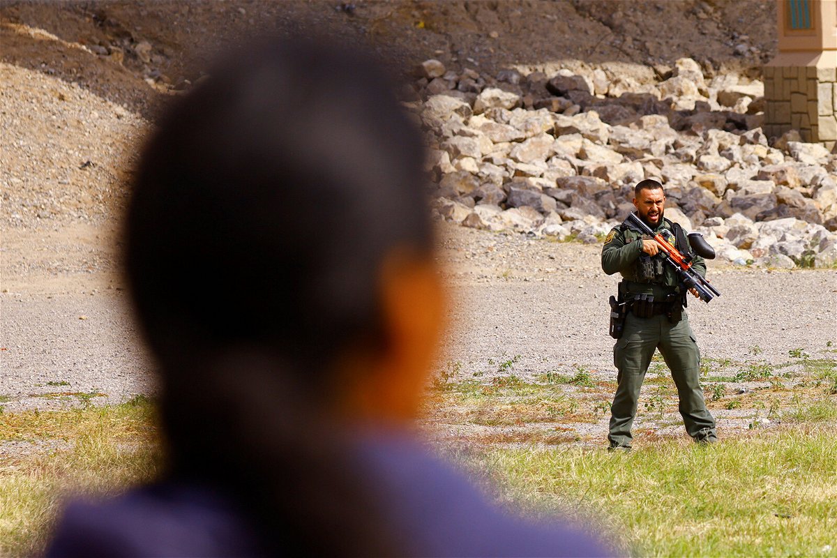 <i>Jose Luis Gonzalez/Reuters</i><br/>A US Border Patrol agent stands guard at the US-Mexico border on October 31.