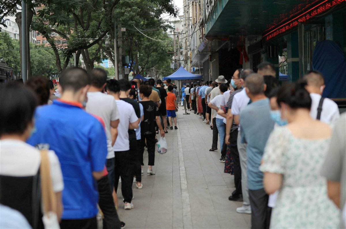 <i>Yang Zhibin/VCG/Getty Images</i><br/>Death of a 3-year-old boy at a locked down residential compound in northwestern China fuels backlash against China's zero-Covid policy. People here line up for Covid tests on July 12