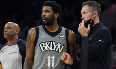 Irving talks with now-former head coach Steve Nash during a game against the San Antonio Spurs on Friday