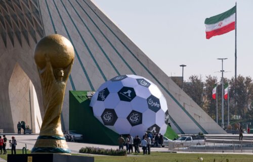 Sculptures of the FIFA World Cup trophy and a soccer ball are seen here in the west of Tehran on November 18. The families of Iran's World Cup soccer team have been threatened if the players fail to "behave" ahead of the match against the USA on November 28.
