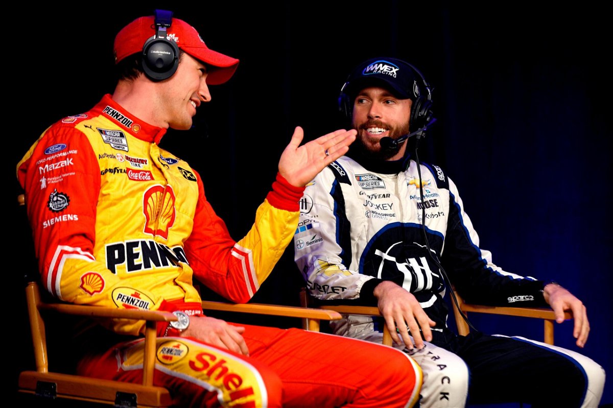 <i>Sean Gardner/Getty Images</i><br/>Joey Logano (left) and Ross Chastain talk during a roundtable discussion at the NASCAR Championship 4 Media Day at Phoenix Raceway on November 3