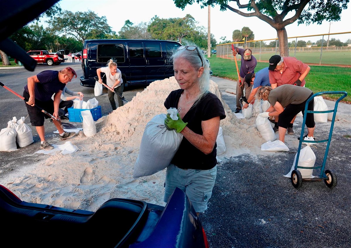 Sandbags are distributed Tuesday at Mills Pond Park in Fort Lauderdale