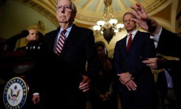 Senate Minority Leader Mitch McConnell talks to reporters in December 2021 in Washington
