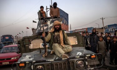 Taliban is imposing their interpretation of Sharia law in Afghanistan. Taliban fighters are pictured here on a Humvee in Kabul