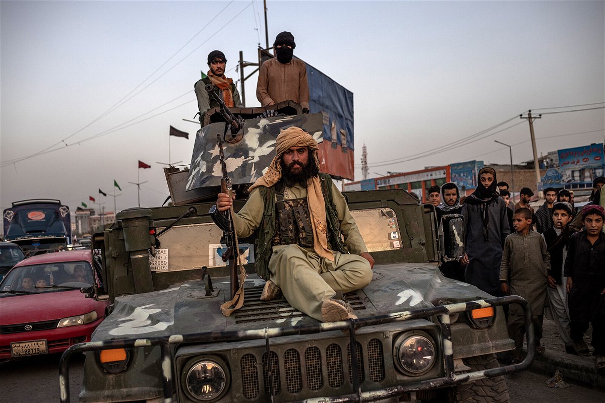 Taliban is imposing their interpretation of Sharia law in Afghanistan. Taliban fighters are pictured here on a Humvee in Kabul
