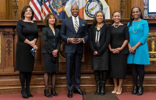 Mayor Eric Adams poses with five women who were appointed as his deputies last year. From L-R Lorraine Grillo