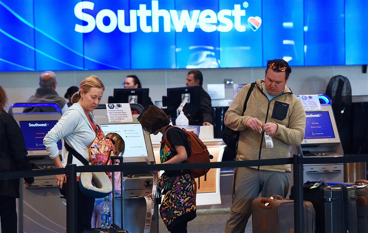 ORLANDO, FLORIDA, UNITED STATES - DECEMBER 28: Travelers tag their bags at a Southwest Airlines ticket counter during the busy Christmas holiday season at Orlando International Airport on December 28, 2022 in Orlando, Florida. The holiday travel period has been plagued by a winter storm and thousands of delayed and cancelled flights, the majority of which have occurred at Southwest Airlines. (Photo by Paul Hennessy/Anadolu Agency via Getty Images)