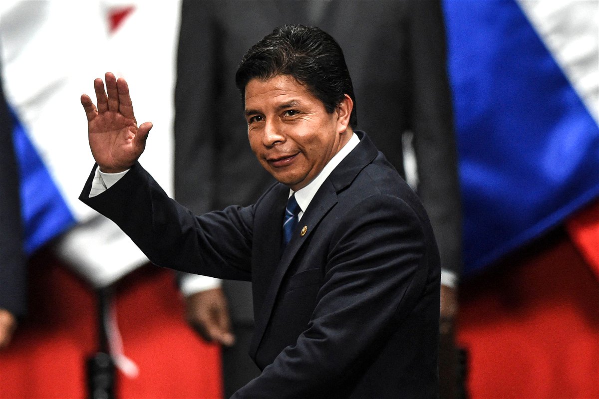 Peruvian President Pedro Castillo waves during the inauguration of the 52nd General Assembly of the OAS in Lima on October 5, 2022. (Photo by Ernesto BENAVIDES / AFP) (Photo by ERNESTO BENAVIDES/AFP via Getty Images)