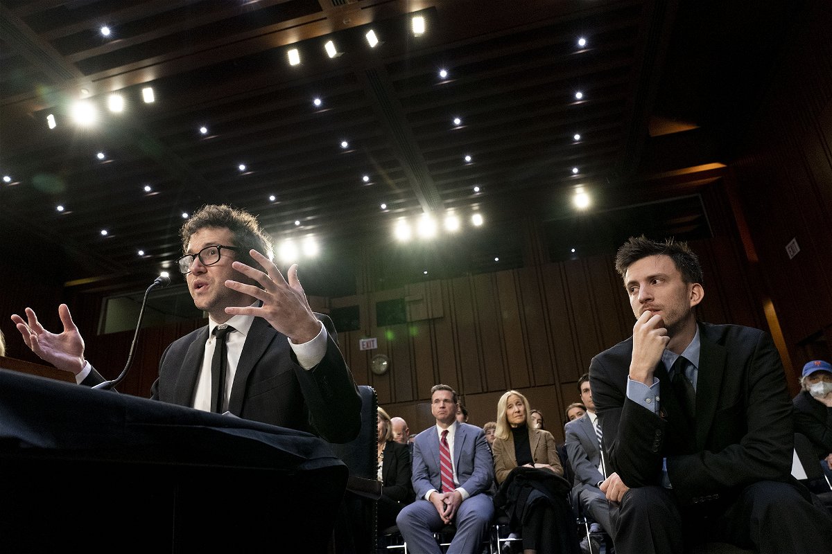 Bandmate Jordan Cohen (right) listens as singer-songwriter Clyde Lawrence (left) testifies before a Senate Judiciary Committee hearing on January 24 to examine promoting competition and protecting consumers in live entertainment.