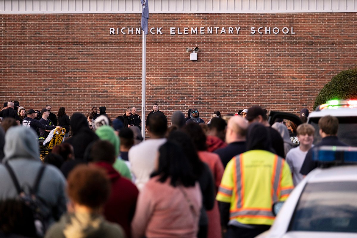 <i>Billy Schuerman/AP</i><br/>Students and police gather outside of Richneck Elementary School in Newport News